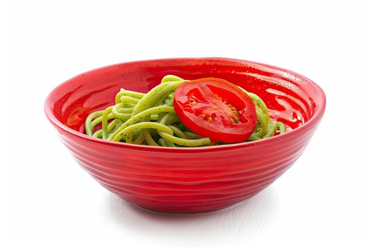 Delicious green spaghetti with fresh vegetable on elegant ceramic plate isolated on white background