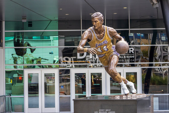 A bronze statue of the LA Lakers basketball player Jerry West in front of Crypto.com Arena in Los Angeles California USA