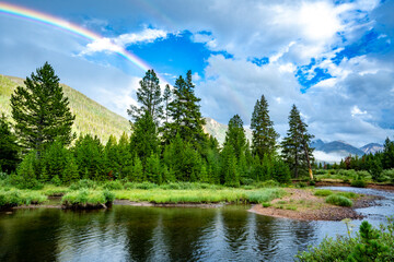 Fototapeta na wymiar Rainbow in the Rocky Mountains