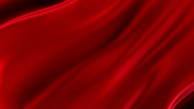 Elegant red fabric waves create a serene visual display at twilight with glimmers of light reflecting off the surface