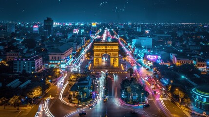 Arc de Triomphe in Vientiane, Lao PDR, night aerial view. There are colorful fireworks. - obrazy, fototapety, plakaty