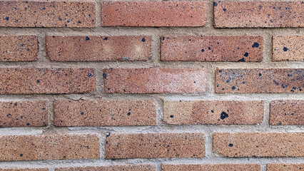 Red rustic brick wall texture or background.