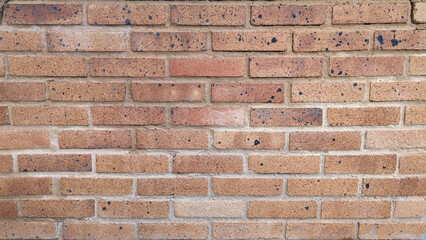 Red rustic brick wall texture or background.