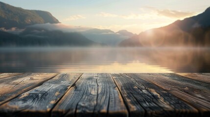 Empty wooden table top with blurred background of mountains Lake at sunset, thin fog - obrazy, fototapety, plakaty