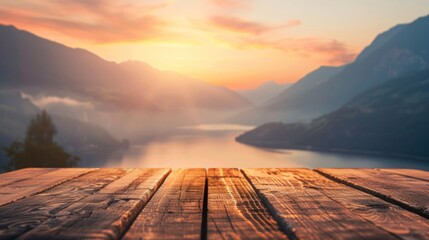 Empty wooden table top with blurred background of mountains Lake at sunset, thin fog