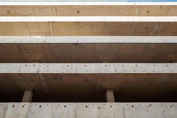 Architectural structure, showcasing the raw texture of concrete with visible formwork patterns,...