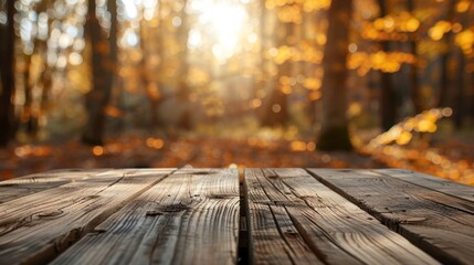 Empty rustic wooden table for displaying products with blurred background of autumn forest.