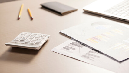 Desk with calculators for calculating, managing and
analyzing economic profits and losses.