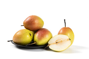 ripe pear fruit with half and slices isolated on white background