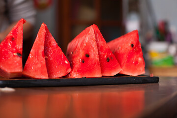 Photograph of cut watermelon slices on a table. Food concept.