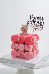 birthday cake with macaroons and candles food anniversary concept cover banner background. Macaroons cake
