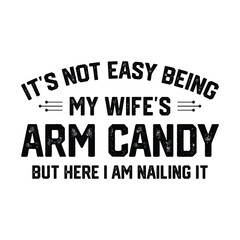 Obraz premium It's Not Easy Being My Wife's Arm Candy But Here I Am Nailing It T-shirt Design Vector Illustration