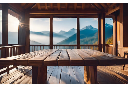 Wooden terrace with panoramic mountain view at sunrise, tranquil nature scene.