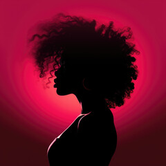 Silhouette of a woman with an afro in pink backlight