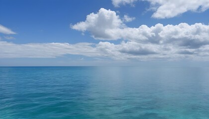 Fototapeta na wymiar A large body of water with clouds in the sky calm ocean landscape
