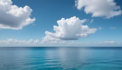 Obraz premium A large body of water with clouds in the sky calm ocean landscape
