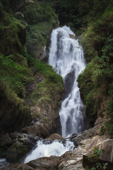 Fototapeta premium Scenic Sialogo waterfall in the rainforest of Asahan Valley in tropical Sumatra island, North Sumatra province, Indonesia