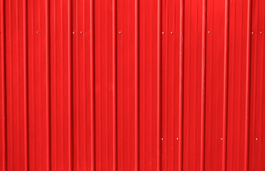 red metal decking. new, modern Sheets of yellow corrugated iron.  Texture of orange metal fence,...