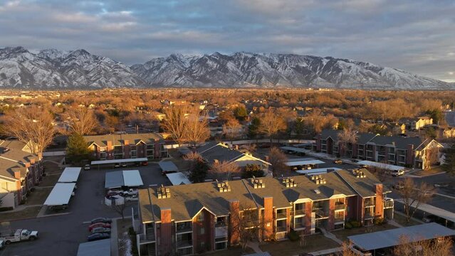 flyover Candlestick Lane community apartments with mountains view before sunset