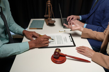 A lawyer, investor, businessman, or entrepreneur is reviewing a business contract or insurance...