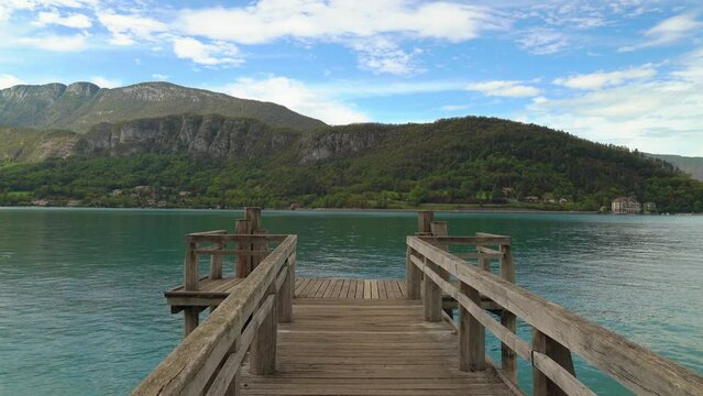 Wooden Pier near Lake Annecy with a View to Mountains