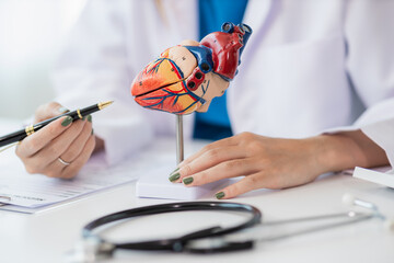 Heart Disease Dr. Ying provides advice on heart disease treatment. A cardiologist while giving a...