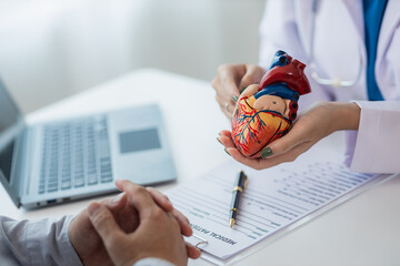 Heart Disease Dr. Ying provides advice on heart disease treatment. A cardiologist while giving a...