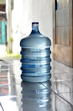 one gallon bottle containing mineral water for drinking