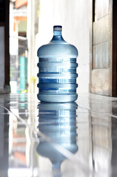 one gallon bottle containing mineral water for drinking