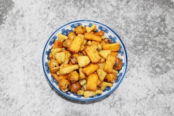 Japanese Rice Crackers on plate, marble background