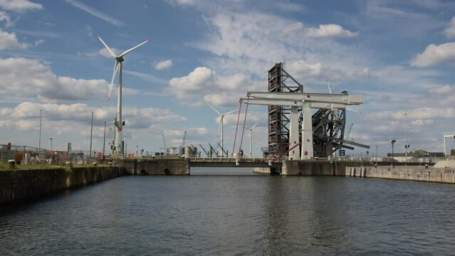 Wind turbines and the Building of Lillo Bridge at the Port of Antwerp, Belgium - Wide Shot




