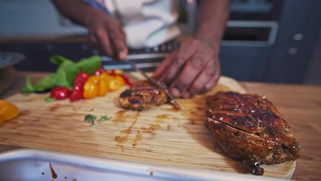 Jamaican jerked chicken being sliced