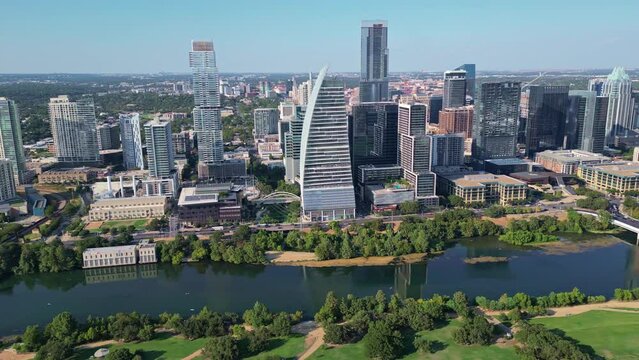 Panning view over Colorado river of the most famous landmarks in Austin, Texas