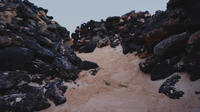 Volcanic rock enclave in corralejo feurteventura at sunrise