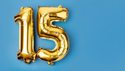 Banner with number 15 golden balloon with copy space. Fifteen years anniversary celebration concept on a blue background.