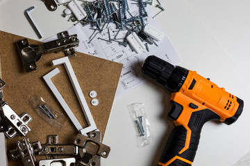 Furniture fittings. Furniture assembly hardware options and tools on a white background.