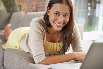 Woman, computer and relax on sofa with online planning, education and research for remote e...