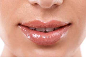 Naklejka premium Closeup, mouth and shine with woman for beauty, makeup with gloss or oil for hydration and wellness. Lip care, cosmetics and teeth for dental health, treatment and moisturizing lips for dermatology