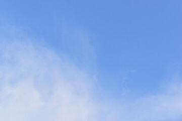 beautiful blue sky and white fluffy cloud with sunrise in the morning, natural background