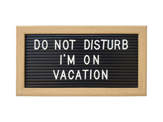 Do Not Disturb I'm on Vacation letter board with wooden frame. Isolated on white background with clipping path.