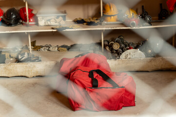 A red rescue equipment bag was placed on the floor. In a room full of rescue equipment