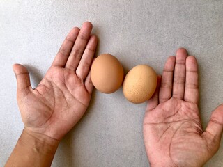 Eggs beside hand