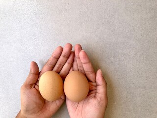 hand holding eggs