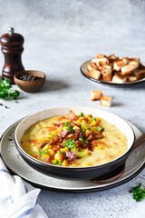 .Corn soup with vegetables and bacon