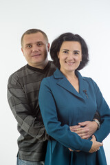 studio portrait of husband and wife happy family 3