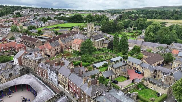 Drone Shot of Alnwick England UK, Old Medieval Town Buildings Church, Pottergate Tower Landmark