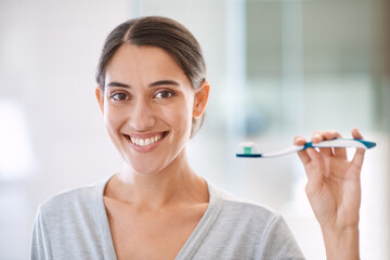 Woman, portrait and toothbrush with smile in home for health, wellness and care for teeth in morning. Girl, person and happy for teeth whitening, mouth and cleaning for hygiene at apartment in Chile