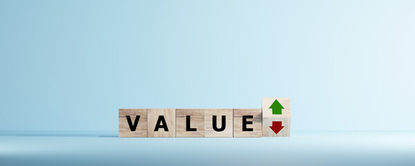 Business value and price concept. Wooden cubes block with value text, down to up arrow.