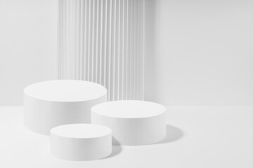 Three white round podiums with striped column as geometric decor, set, mockup on white background. Template for presentation cosmetic products, gifts, goods, advertising, design in modern style.