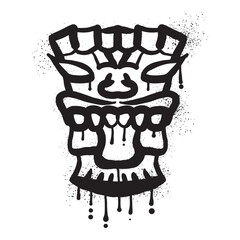 Wooden tiki mask graffiti with black spray paint art